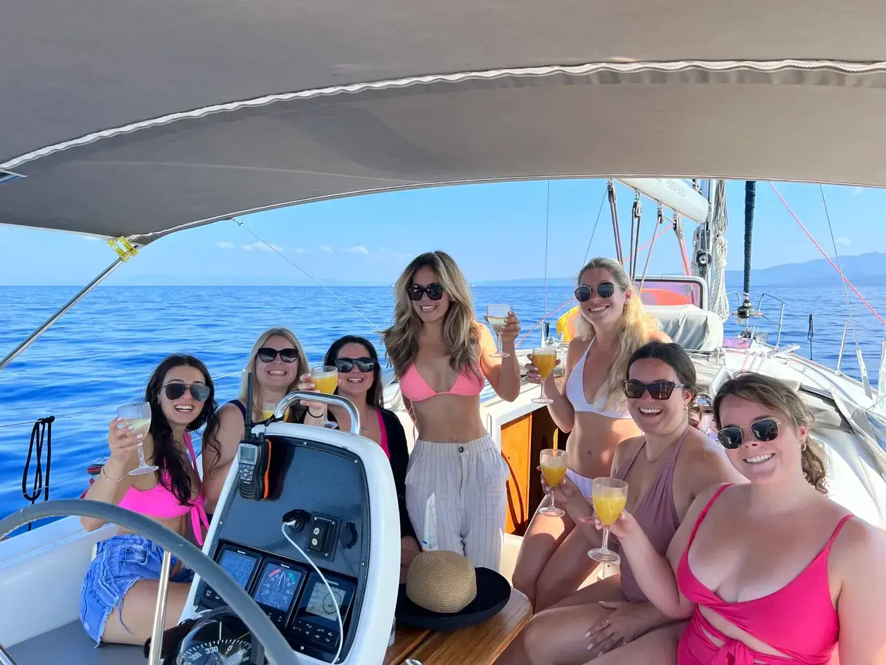 Bachelorette party on a sailing yacht in Halkidiki — group of women celebrating on the water