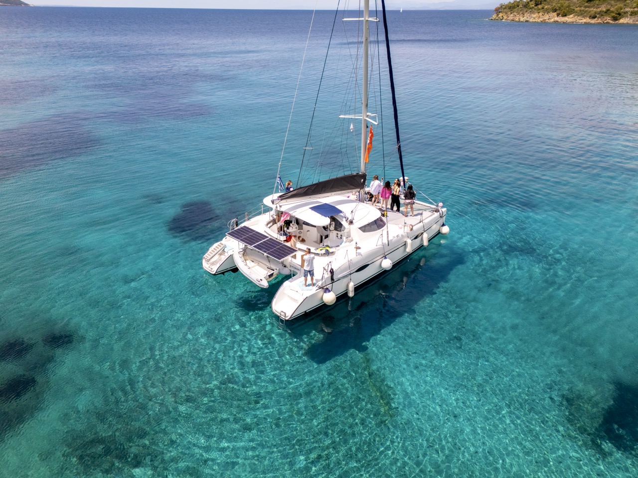 Catamaran full day cruise Halkidiki — friends enjoying crystal clear turquoise waters