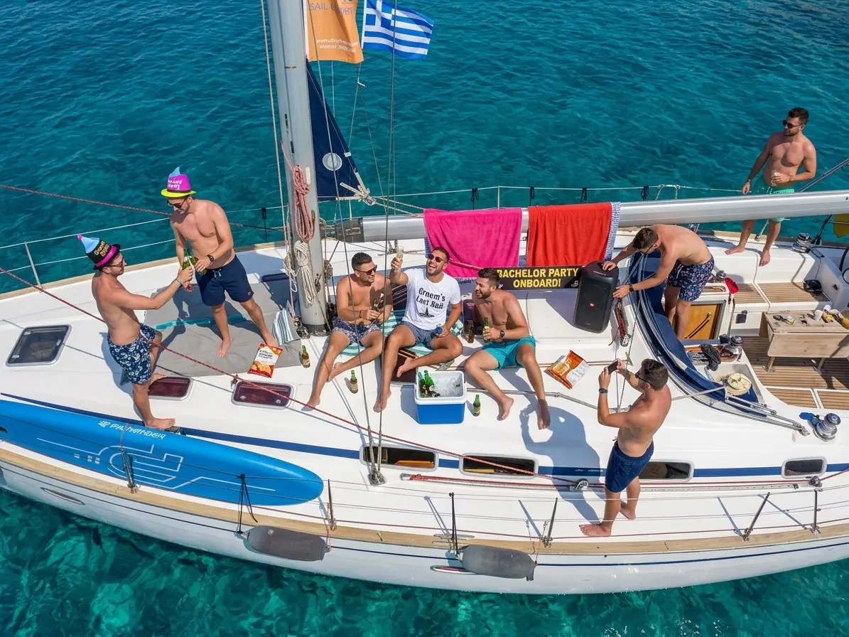 Bachelor party Halkidiki - group of men on a sailing yacht in the crystal clear waters of Halkidiki